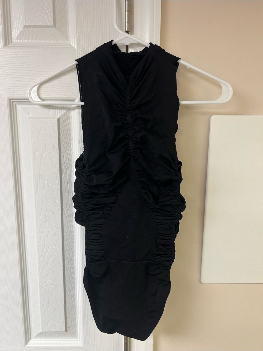 NUX black sleeveless mock-neck ruched bodysuit